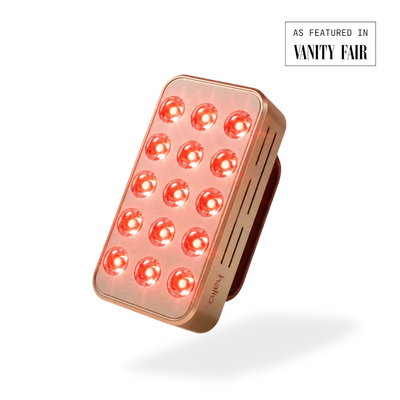 Rectangular LED device with red lights on a white background, featuring 'Vanity Fair' branding.