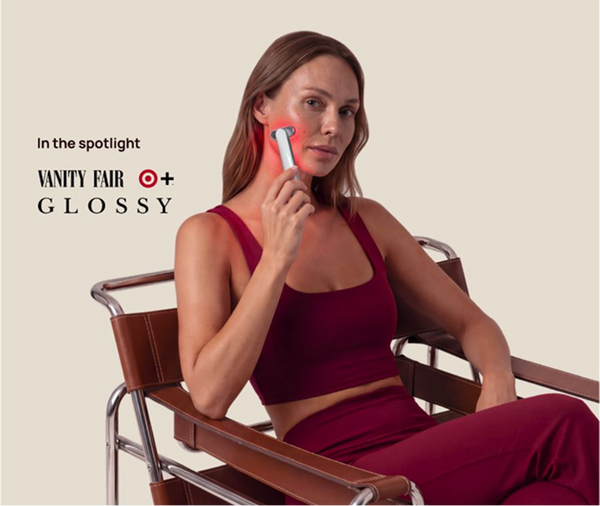 Woman using a Halio facial device; text reads “In the spotlight Vanity Fair + Glossy.”