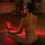 A young girl using Halio RegenBoost Red Light Panel
